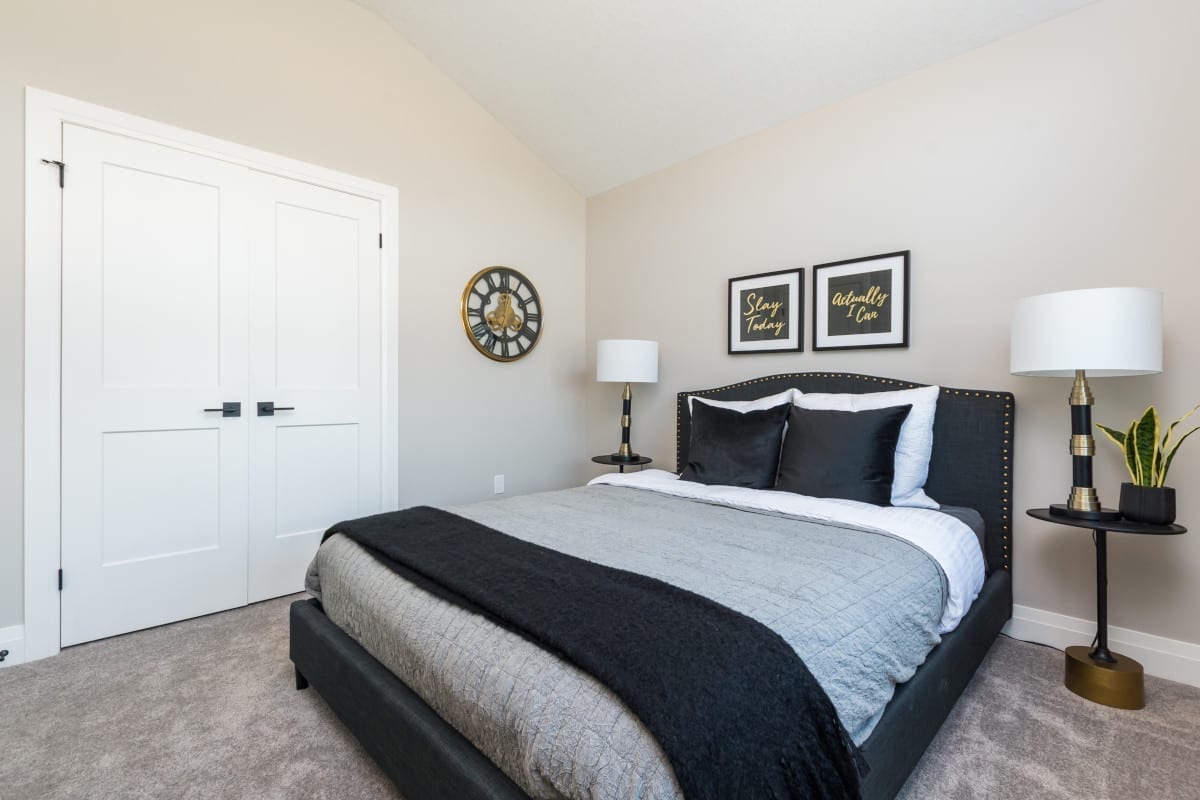 Additional bedroom in a Meadowlily home, styled with dark fabrics and mixed metal details.