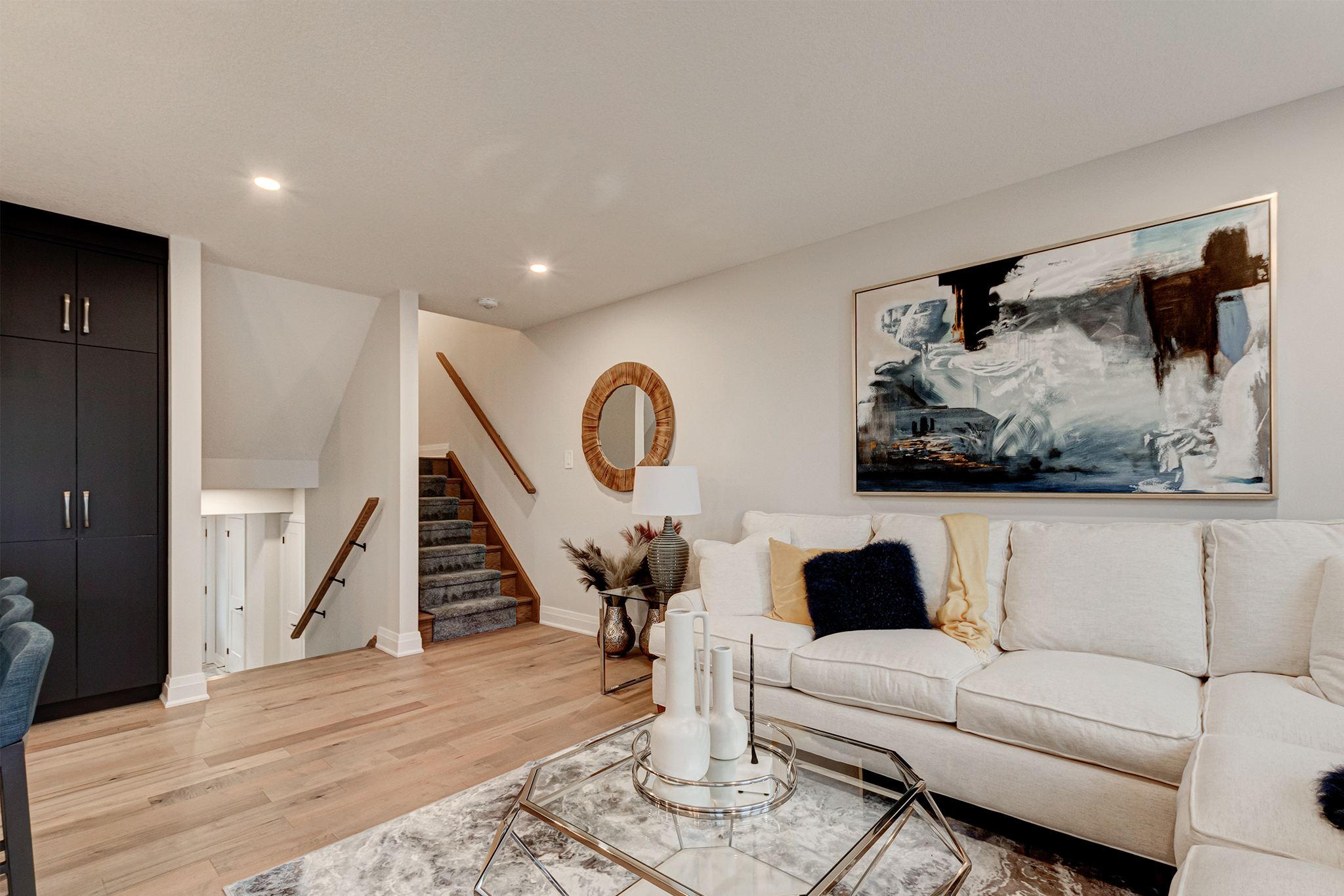 Living area and stairs leading up to the primary ensuite and additional bedrooms.